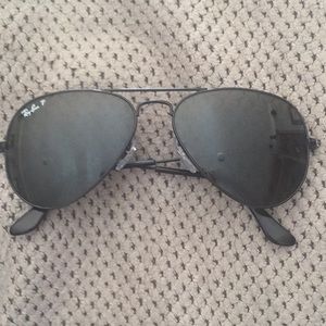 Ray Ban polarized aviator sunglasses in black.